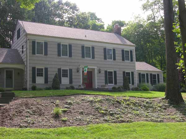 Here’s the before picture, the house without a roof overhang.