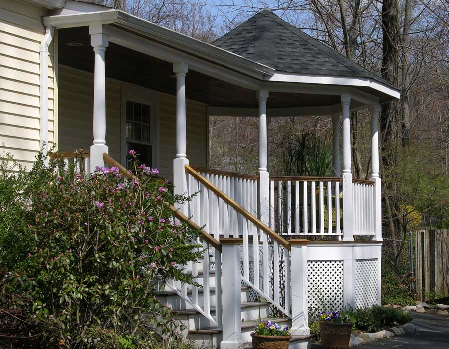 Enhance your visual interest and entertaining space by adding a dramatic porch