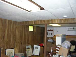 Uninviting basement room before renovation