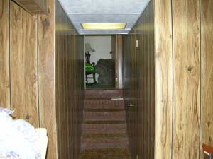 Dark, poorly lit stairway before renovation