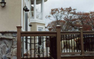 View of the lakeside main deck with Master Bedroom Balcony beyond