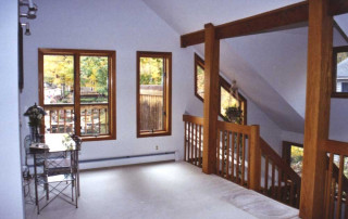 Second floor Loft – overlooks the sunken Living room and Dining room below, and the Lake