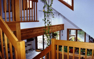 Stair landing with a commanding view of everything, including the lake beyond