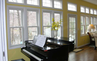 Wall of windows in Great Room with view to rear yard
