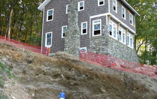 New Main House with excavation for the garage (human for scale)