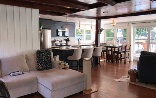 Living / Kitchen / Dining with access to rear deck overlooking the lake