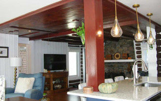 Open plan with original wood ceilings and exposed log walls