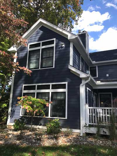 New sunroom with master suite expansion above.