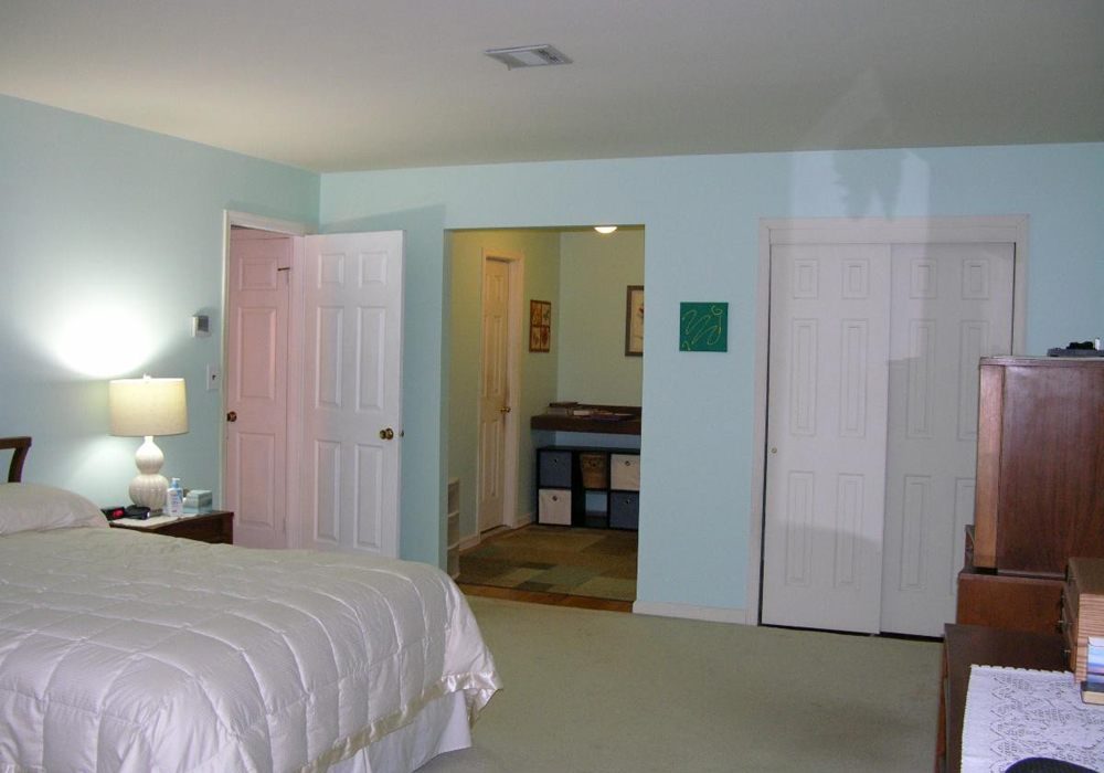 View from the bedroom into the dressing area and closet - before