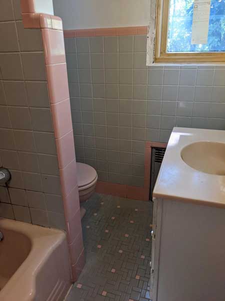 Pink tub, gray and pink tiles