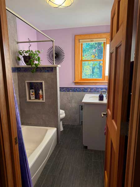 The shorter wall makes the room feel more spacious.