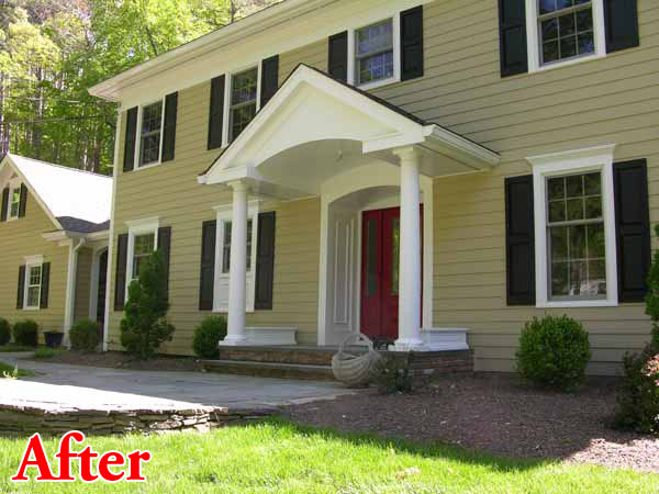 Home facade after addition of a front portico which enhances appearance and while helps protect walls from water damage