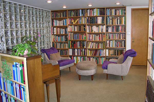 The Library with glass block wall and bookshelves