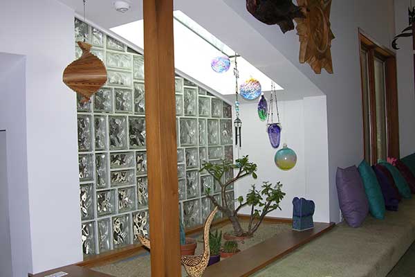 Glass block wall and skylight enhance indoor "garden"