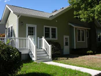 side of house with new door and outside stairs